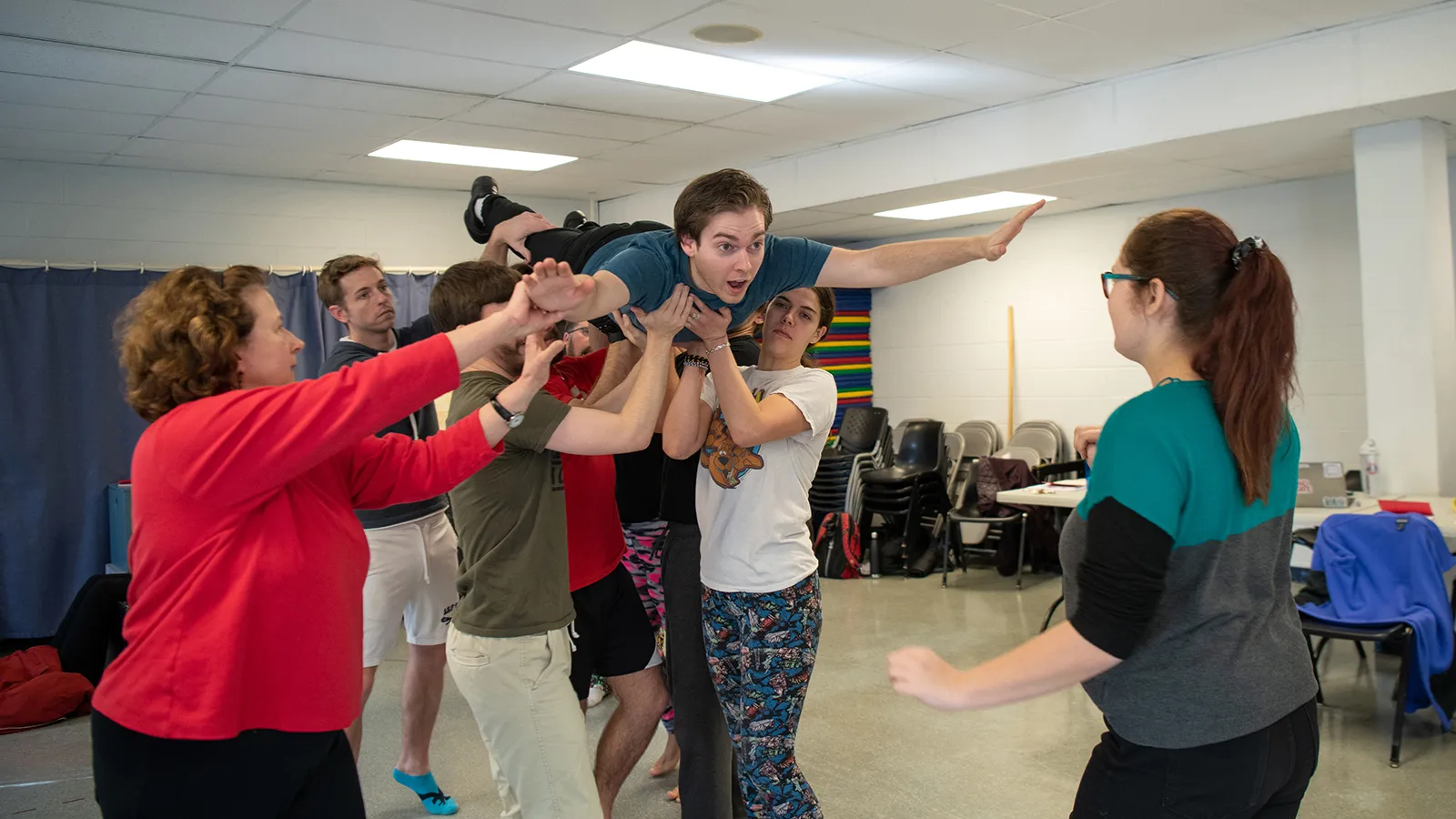 Actors rehearsing movement sequence