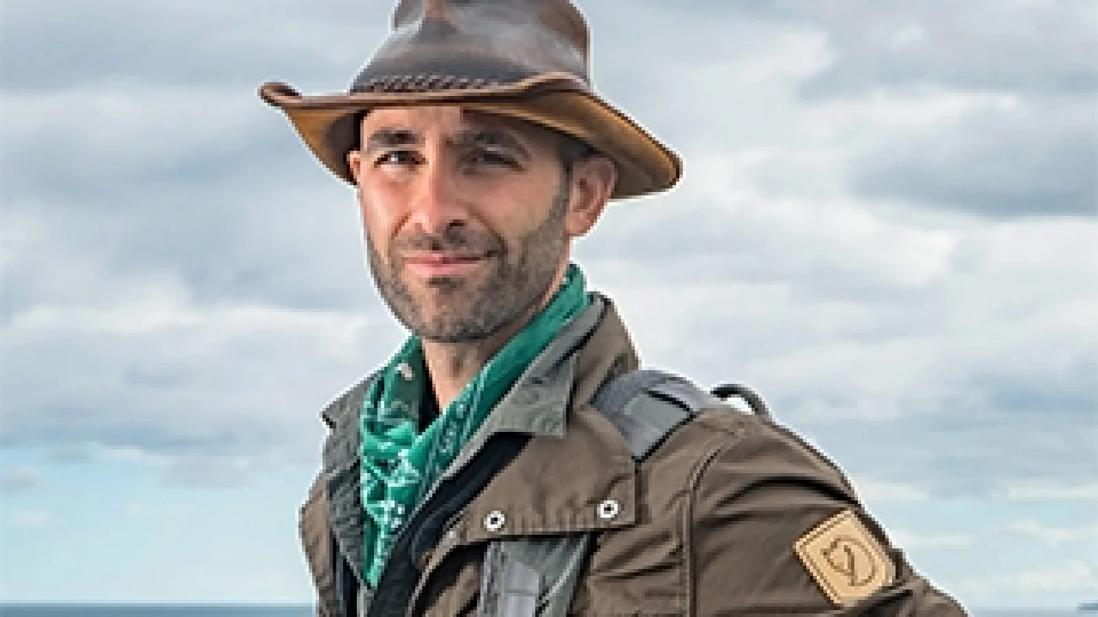 Color image of Coyote Peterson wearing a wide brimmed hat
