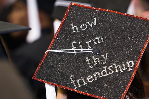 Decorated mortarboard that reads how firm thy friendship