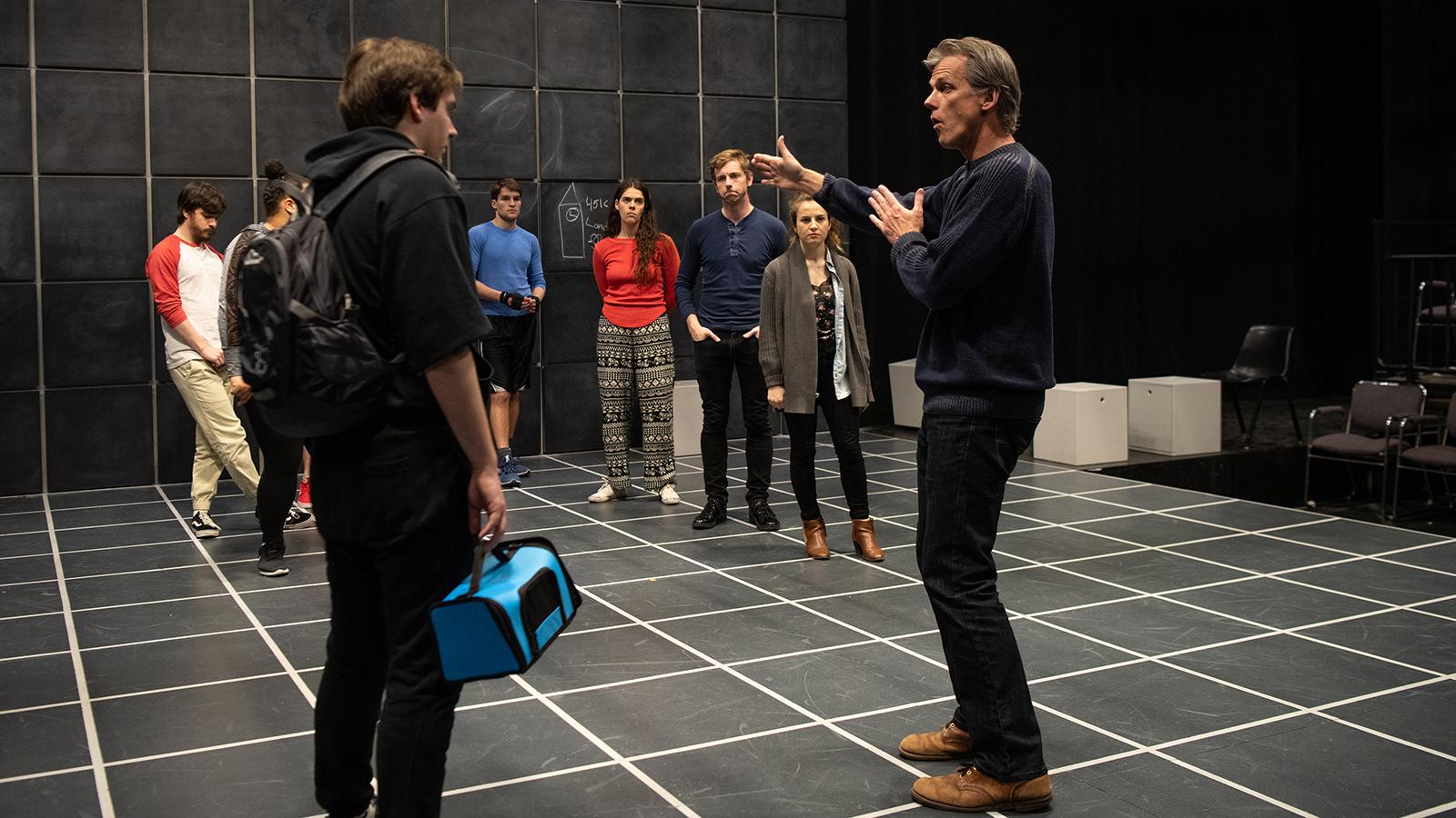 Director and actors in rehearesal