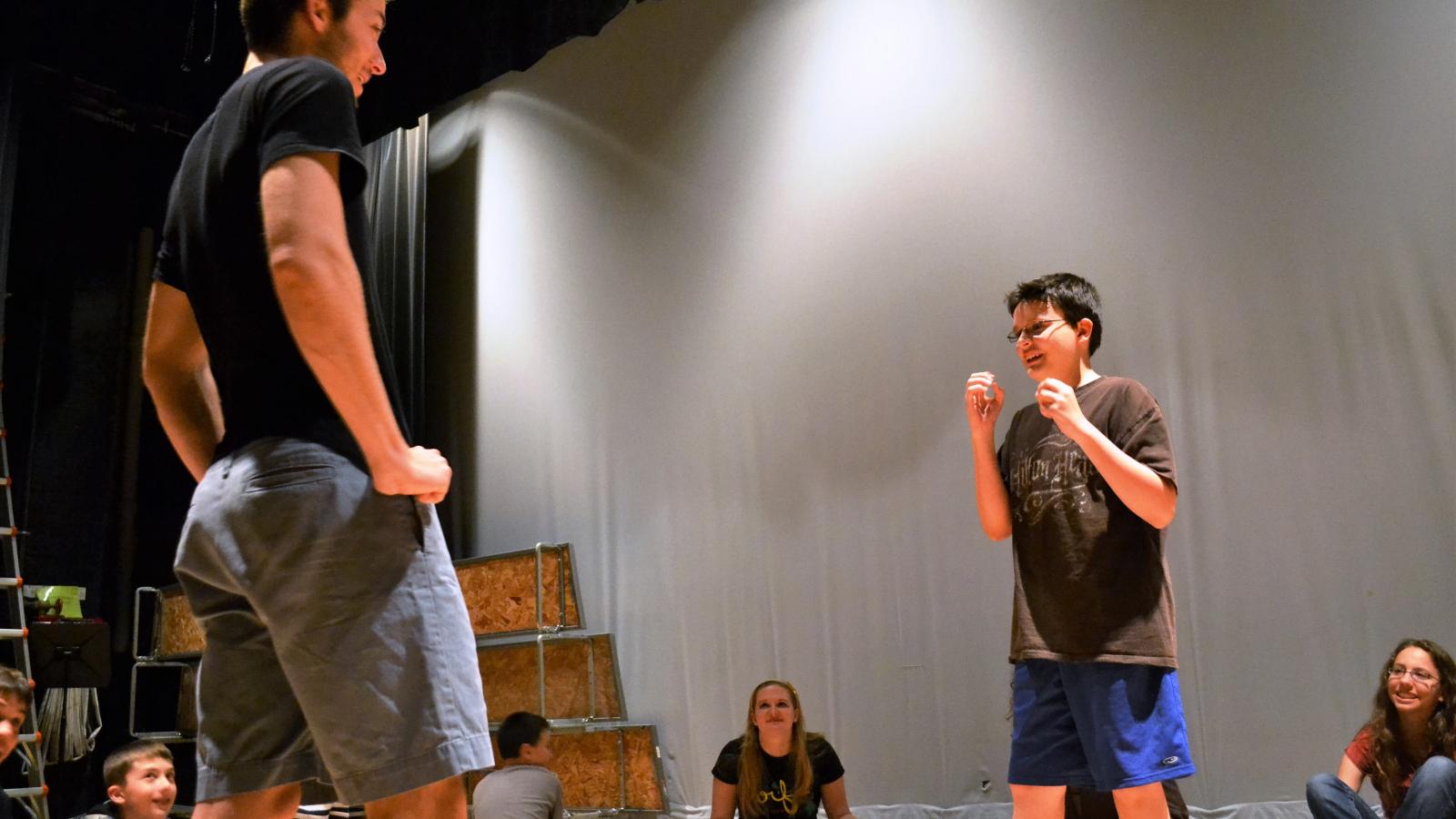 An Ohio State student plays theatre games with a child with autism.