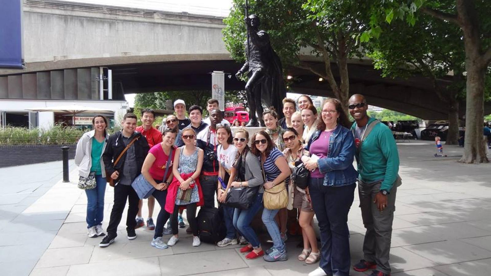 The entire group in front of Lawrence Olivier’s statue at The National Theatre. 