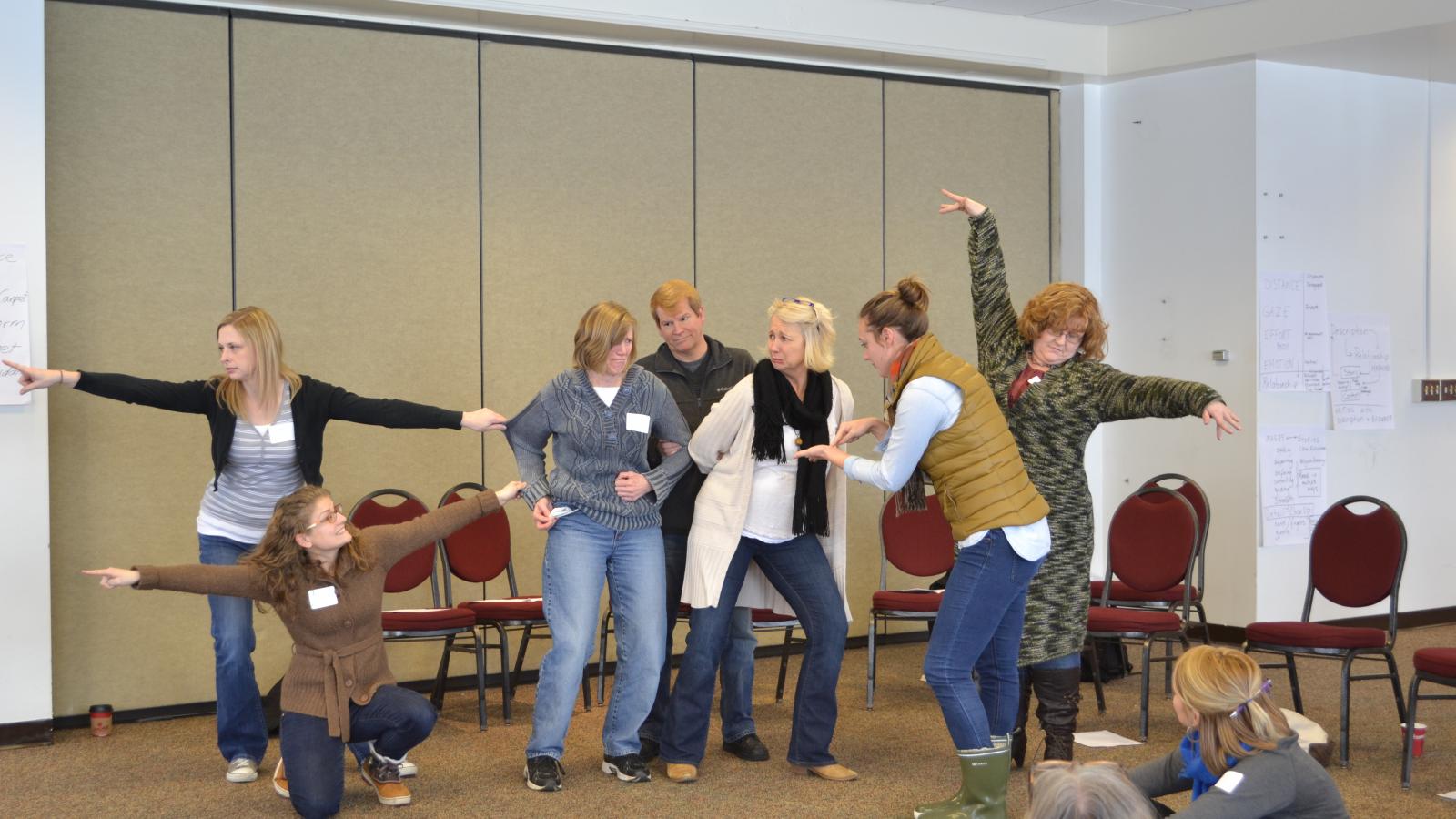 Teachers create a tableau of the dangerous forest of As You Like It at March PD